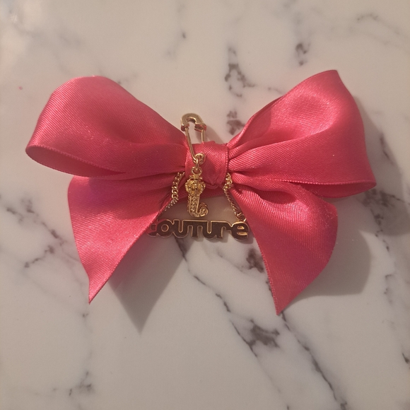 Juicy Couture Other - Juicy Couture Pink Bow with Gold Charm